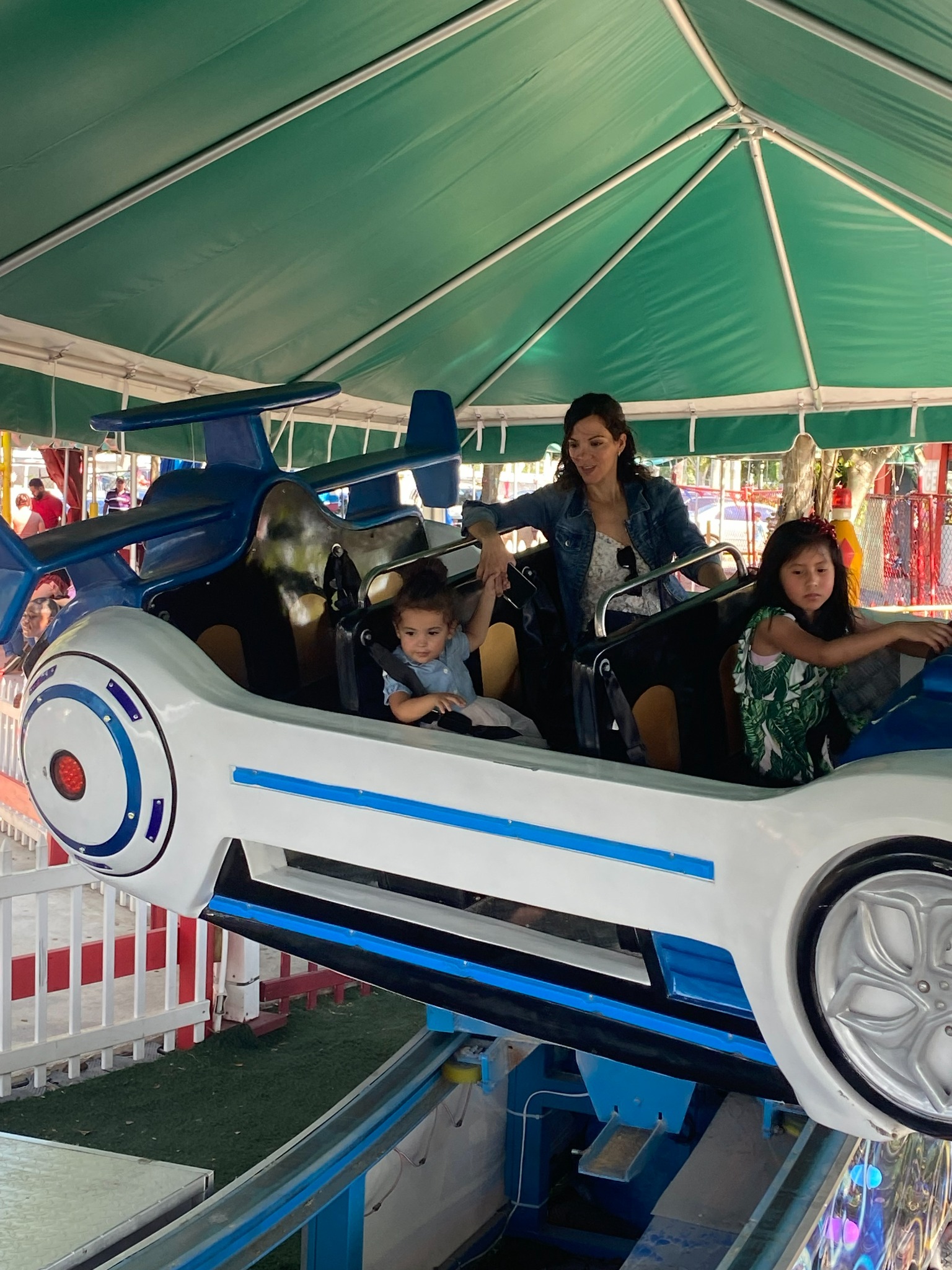 Children riding the Flying Car attraction at Fun Games Adventure Park